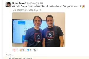 Two people smiling, standing side by side in matching t-shirts.